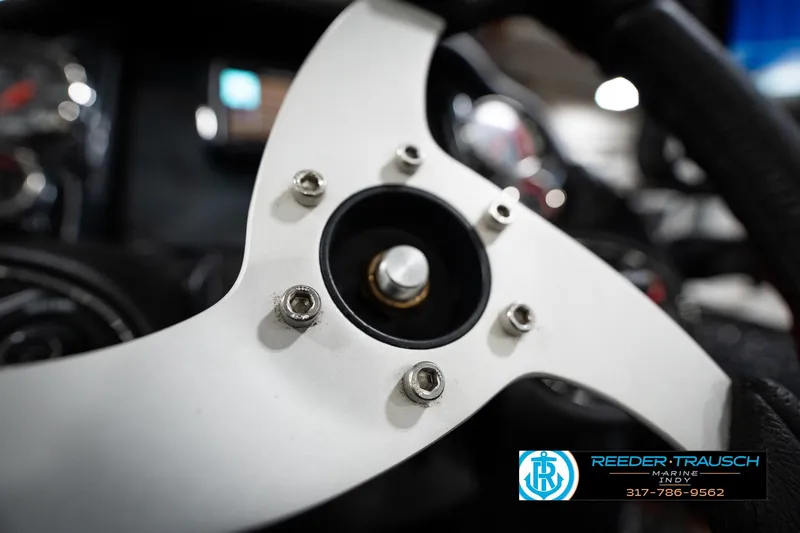 Slide: The Image of Close-up of 2015 Triton 18TRX steering wheel with Reeder-Trausch Marine logo. - 26