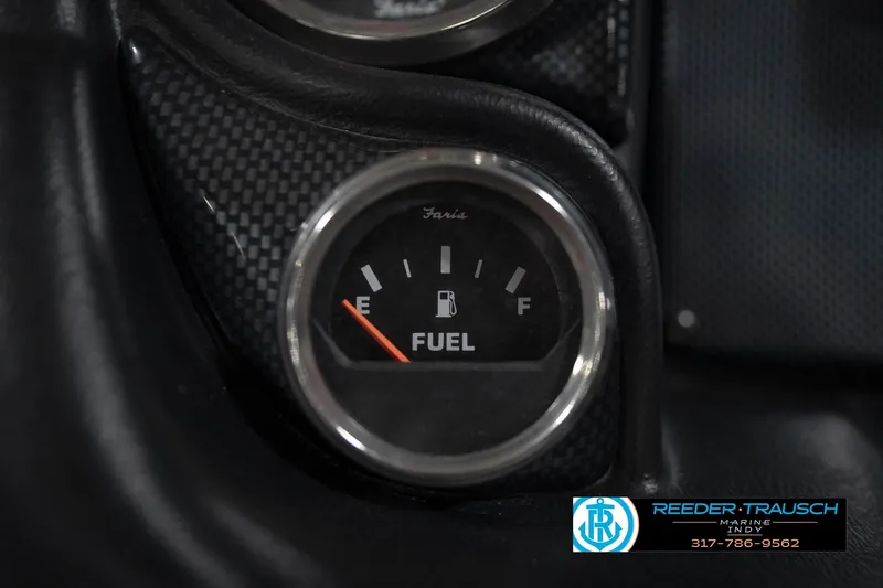 Slide: The Image of Close-up of a 2015 Triton 18TRX fuel gauge, showing empty to full levels. - 28
