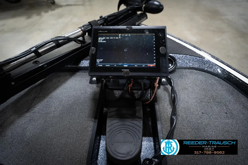 Slide: The Image of Garmin fishfinder on 2015 Triton 18TRX boat, Reeder Trausch Marine logo visible. - 35