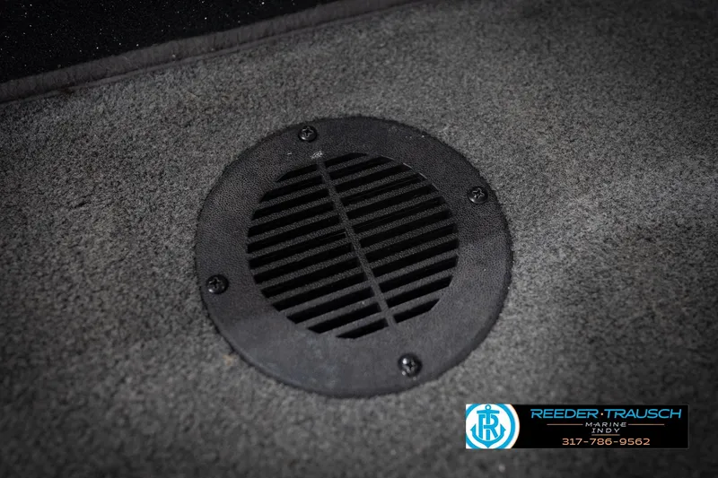 Slide: The Image of Carpeted floor with a round black vent, Triton 18TRX 2015 model. - 42