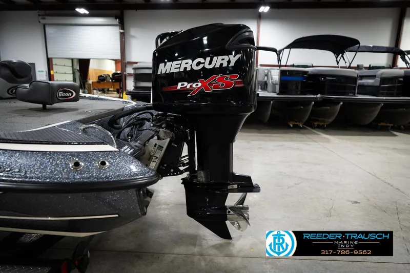 Slide: The Image of 2015 Triton 18TRX boat with Mercury Pro XS engine in a showroom. - 45