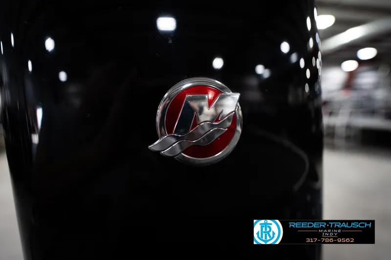 Slide: The Image of 2015 Triton 18TRX boat with Mercury logo, displayed at Reeder-Trausch Marine. - 48