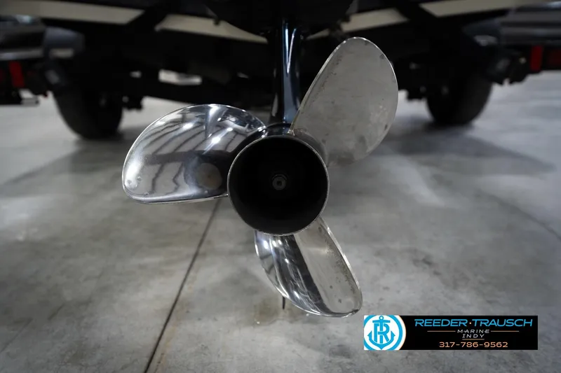 Slide: The Image of Close-up of a 2015 Triton 18TRX boat propeller in a showroom setting. - 49