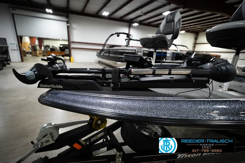 Slide: The Image of 2015 Triton 18TRX boat with MotorGuide trolling motor in a showroom. - 50