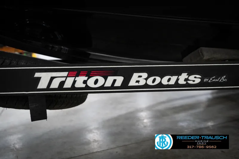Slide: The Image of 2015 Triton 18TRX boat trailer with logo and Reeder Trausch Marine contact details. - 56