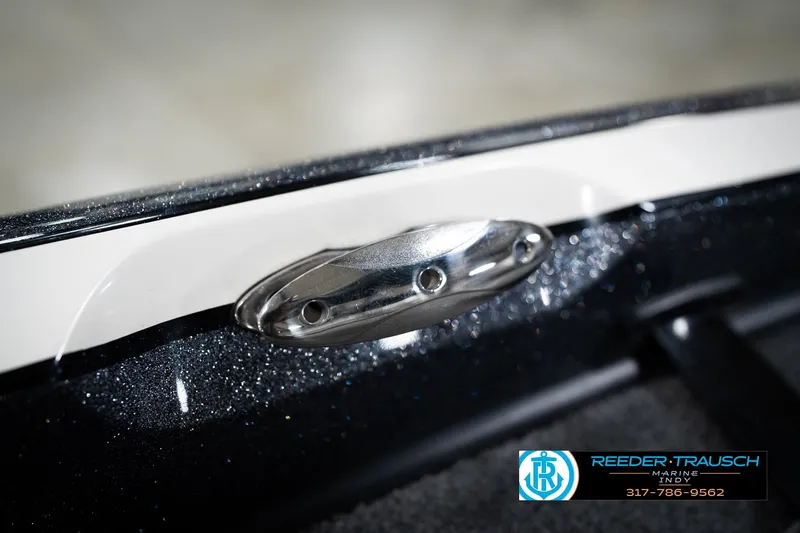 Slide: The Image of 2015 Triton 18TRX boat detail with metallic finish and chrome cleat. - 59