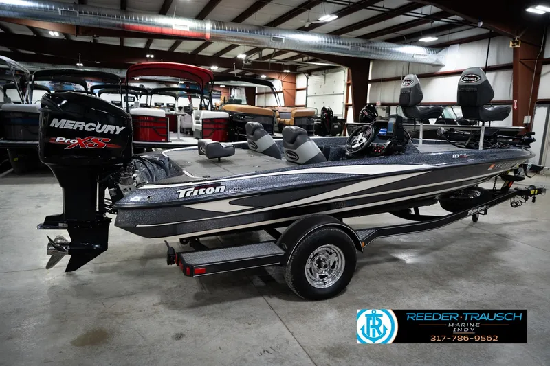 Slide: The Image of 2015 Triton 18TRX boat with Mercury Pro XS engine in showroom. - 6