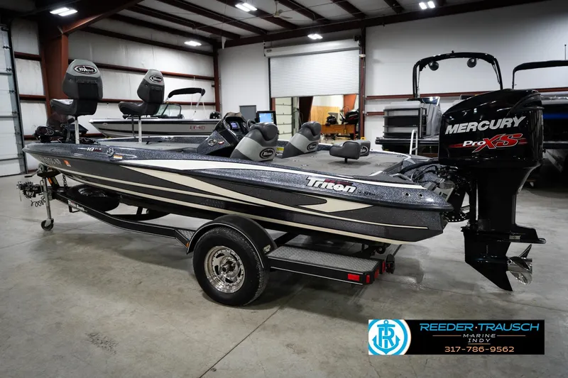 Slide: The Image of 2015 Triton 18TRX boat with Mercury Pro XS engine in showroom. - 8