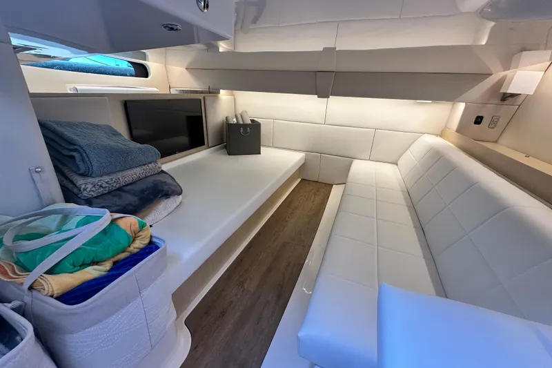 Slide: The Image of Luxurious interior of 2023 Regal 36 Grande Coupe with white seating and modern amenities. - 30