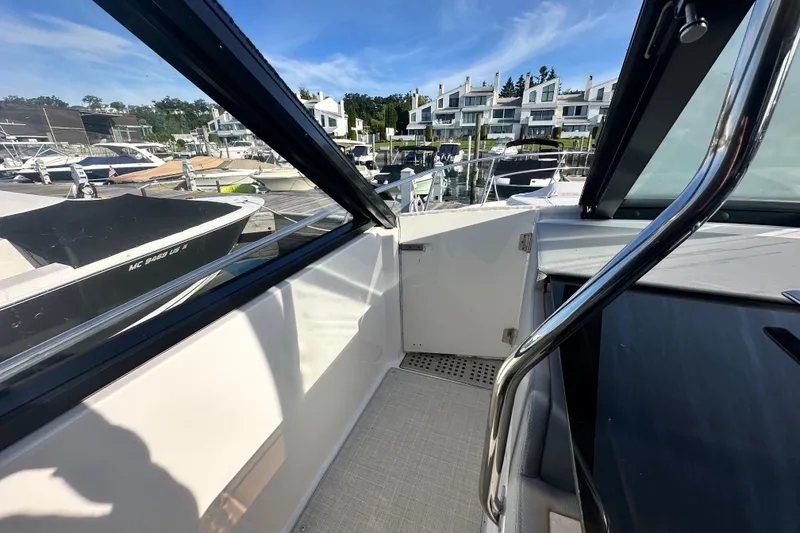Slide: The Image of 2023 Regal 36 Grande Coupe interior view at marina, showcasing sleek design and modern features. - 35