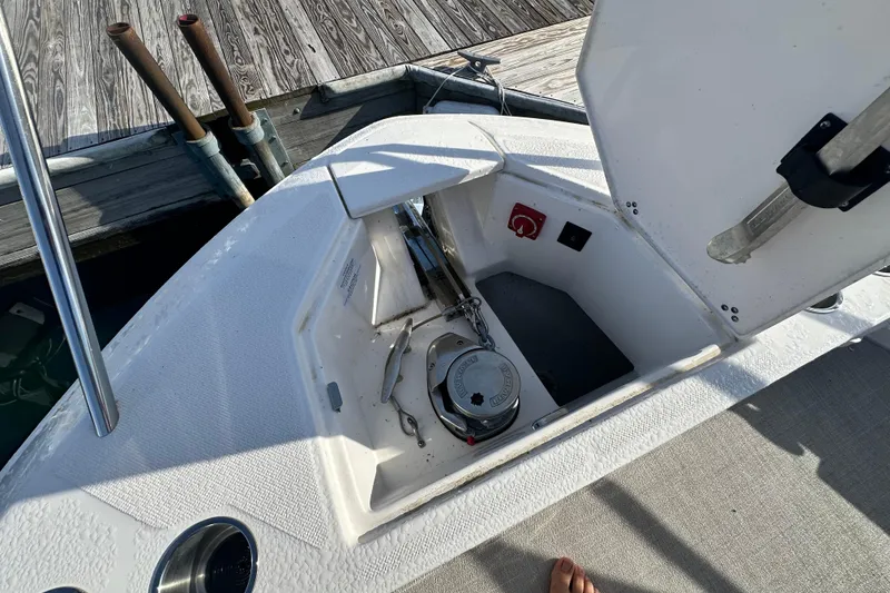 Slide: The Image of 2023 Regal 36 Grande Coupe anchor compartment with open hatch at dock. - 37