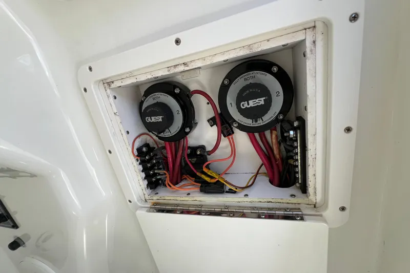 Slide: The Image of Electrical panel of a 2003 Triton 2690 CC boat with wiring and switches. - 18