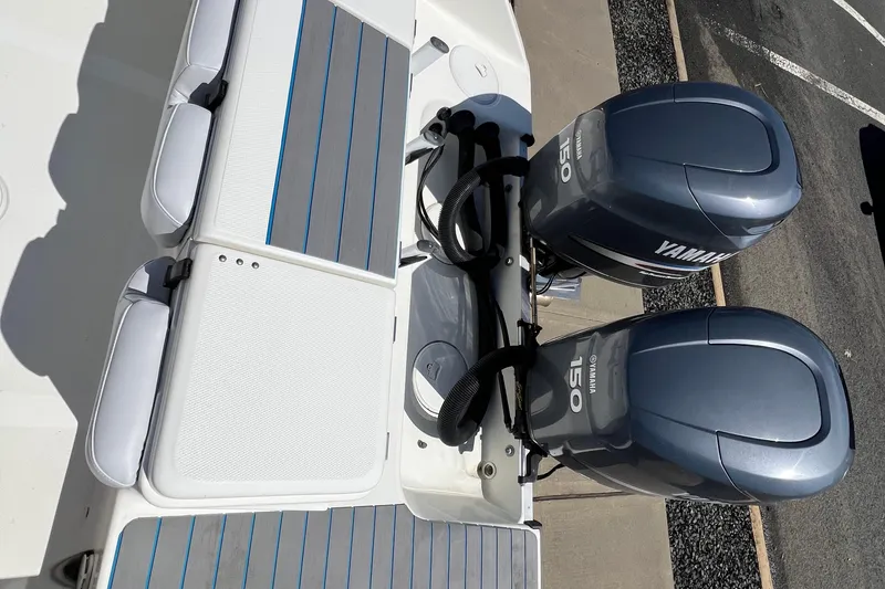 Slide: The Image of 2003 Triton 2690 CC boat with dual Yamaha 150 outboard engines. - 8