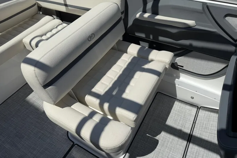 Slide: The Image of 2019 Cobalt R3 boat interior with beige seating and modern design. - 14