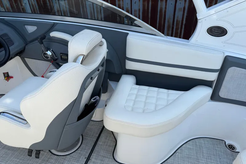 Slide: The Image of 2019 Cobalt R3 boat interior with white and gray seating and dashboard. - 17