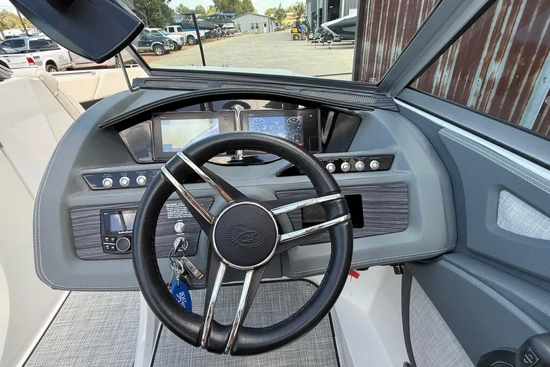 Slide: The Image of 2019 Cobalt R3 boat dashboard with steering wheel and navigation displays. - 8