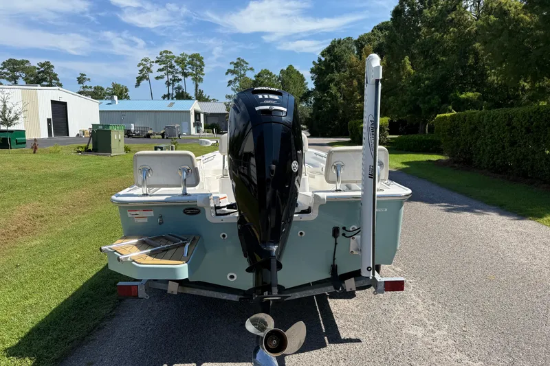 Slide: The Image of 2022 Boston Whaler 170 Montauk boat with outboard motor on a sunny day. - 4