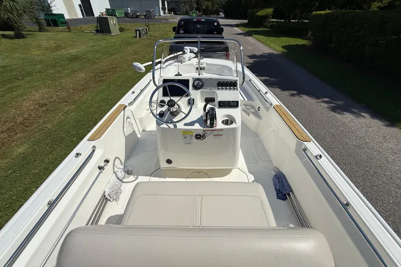 Slide: The Image of 2022 Boston Whaler 170 Montauk boat interior with steering console and seating. - 5