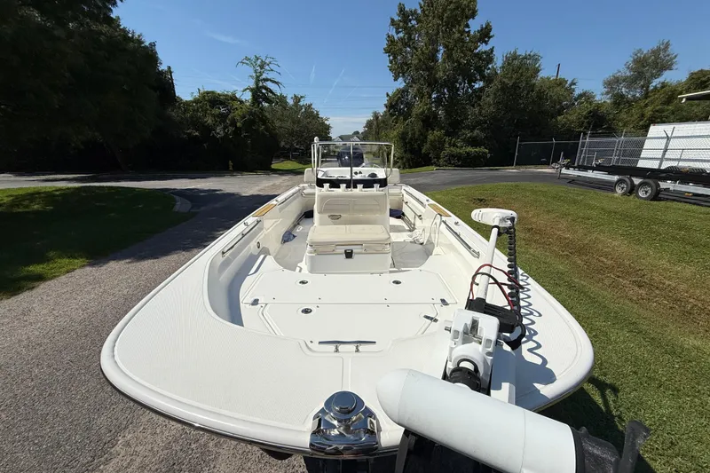 Slide: The Image of 2022 Boston Whaler 170 Montauk boat on a sunny day, parked on grass. - 7