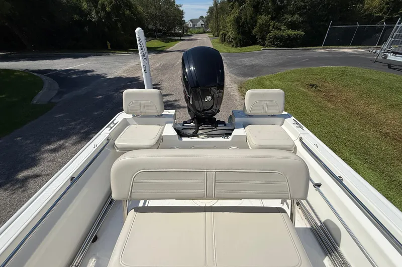 Slide: The Image of 2022 Boston Whaler 170 Montauk boat interior with seating and outboard motor. - 9