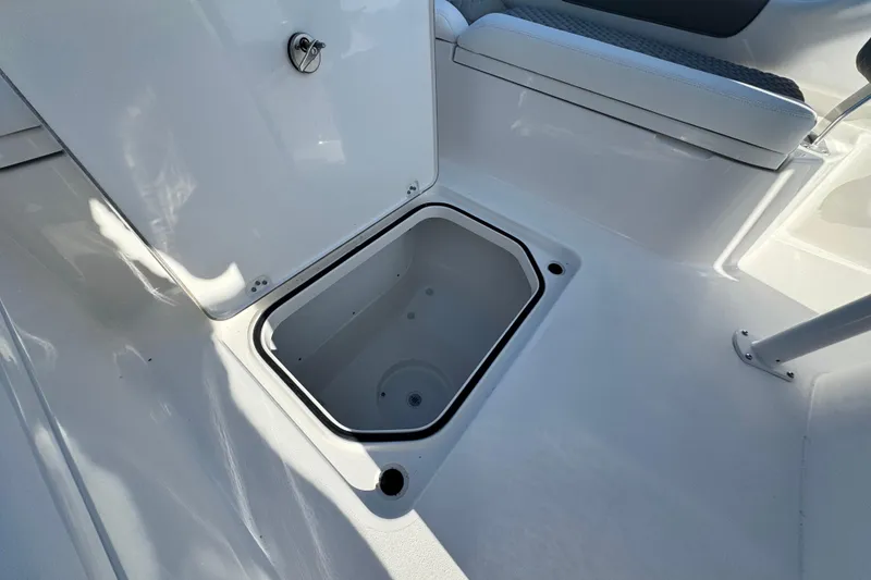 Slide: The Image of Open storage compartment on 2026 Caymas 24 HB boat, showcasing interior space. - 15