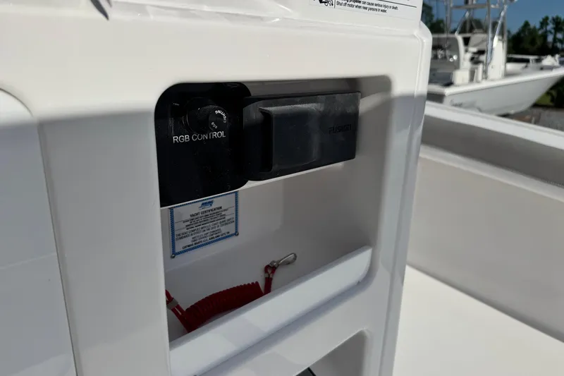 Slide: The Image of 2026 Caymas 24 HB boat featuring RGB control panel and Fusion audio system. - 25