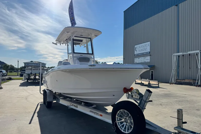 Slide: The Image of 2026 Caymas 24 HB boat on trailer at Grander Marine dealership. - 8