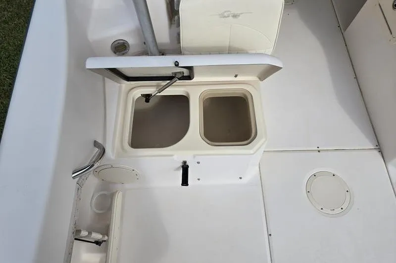 Slide: The Image of 2007 Grady-White Seafarer 228 boat interior with open storage compartments. - 10