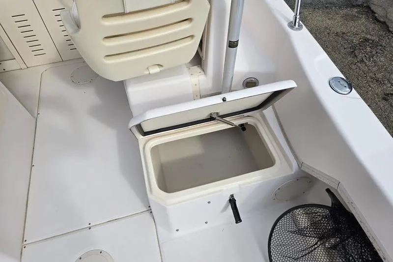Slide: The Image of 2007 Grady-White Seafarer 228 boat interior with open storage compartment. - 12
