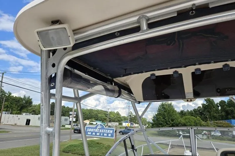 Slide: The Image of 2007 Grady-White Seafarer 228 boat with T-top and speaker, Southeastern Marine sign visible. - 14