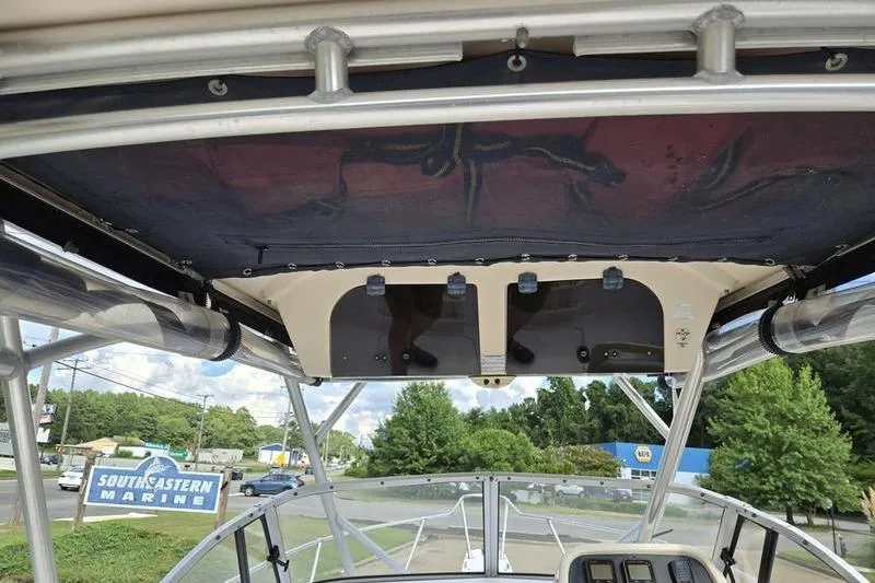 Slide: The Image of 2007 Grady-White Seafarer 228 boat interior with overhead storage and view of Southeastern Marine. - 15