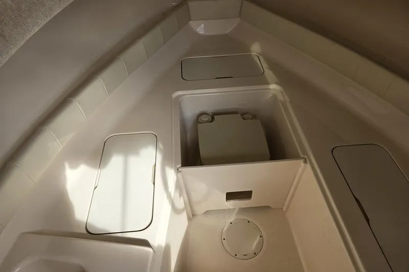 Slide: The Image of 2007 Grady-White Seafarer 228 boat interior with storage compartments and seating. - 17