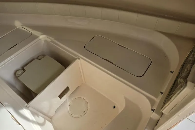 Slide: The Image of 2007 Grady-White Seafarer 228 boat interior with storage compartments and seating area. - 19