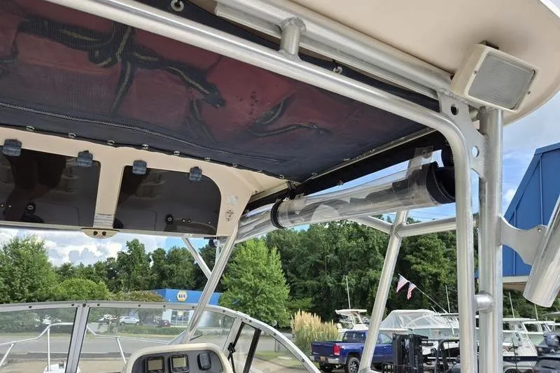 Slide: The Image of 2007 Grady-White Seafarer 228 boat interior with canopy and control panel. - 23