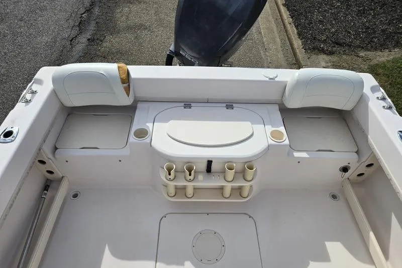 Slide: The Image of 2007 Grady-White Seafarer 228 boat interior with rod holders and seating. - 5