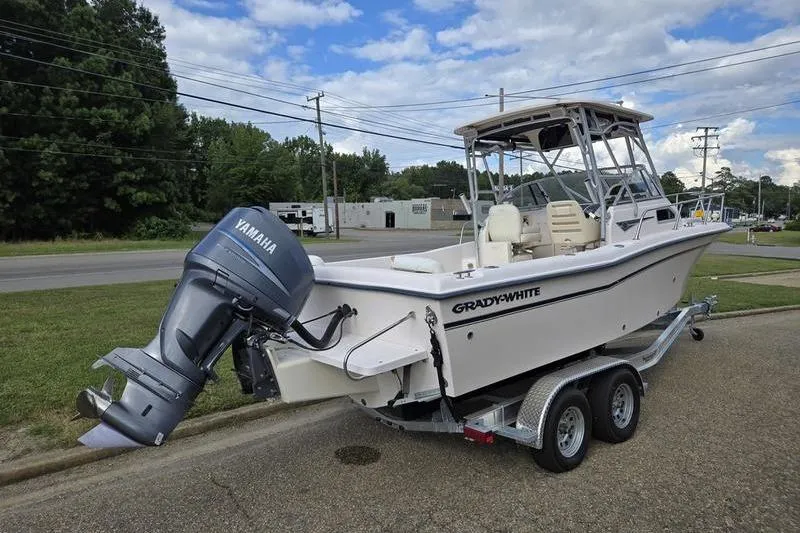 Slide: The Image of 2007 Grady-White Seafarer 228 boat with Yamaha outboard on trailer, parked roadside. - 7