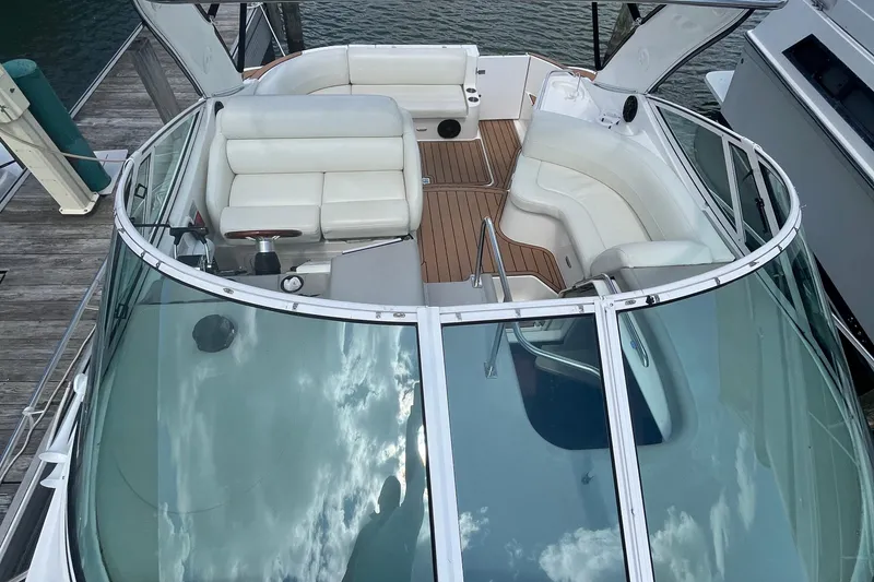 Slide: The Image of 2001 Cruisers Yachts 3470 Express boat with spacious seating and sleek design. - 5