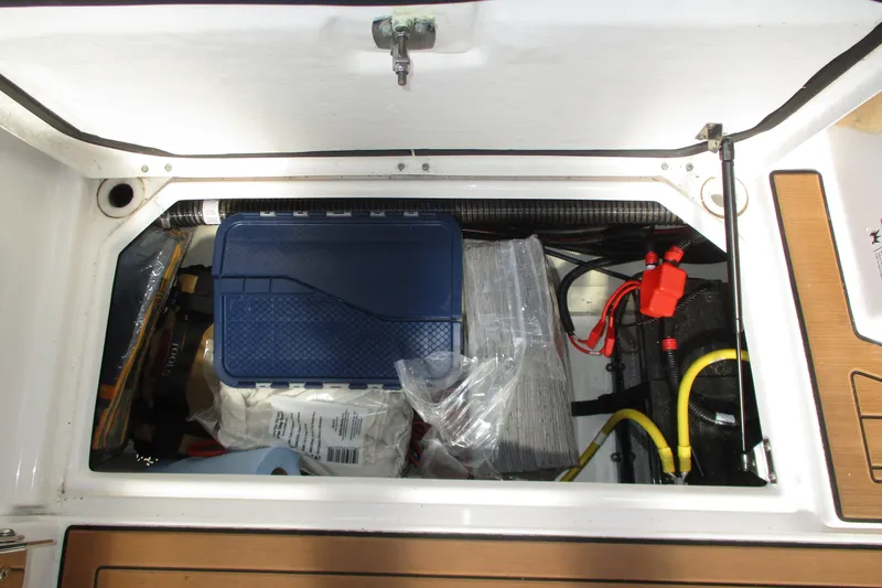 Slide: The Image of Storage compartment of 2022 Ranger Tugs R-27 boat with organized equipment and supplies. - 39