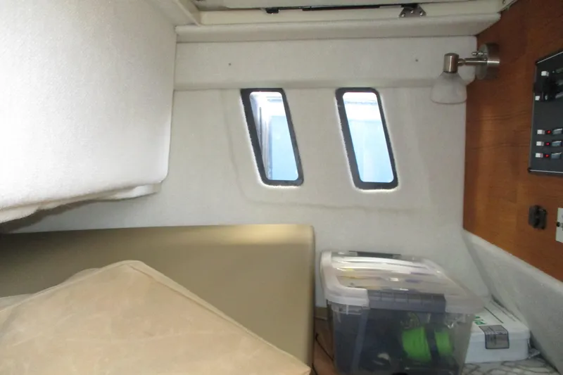 Slide: The Image of Interior cabin of 2022 Ranger Tugs R-27 boat with storage and windows. - 61