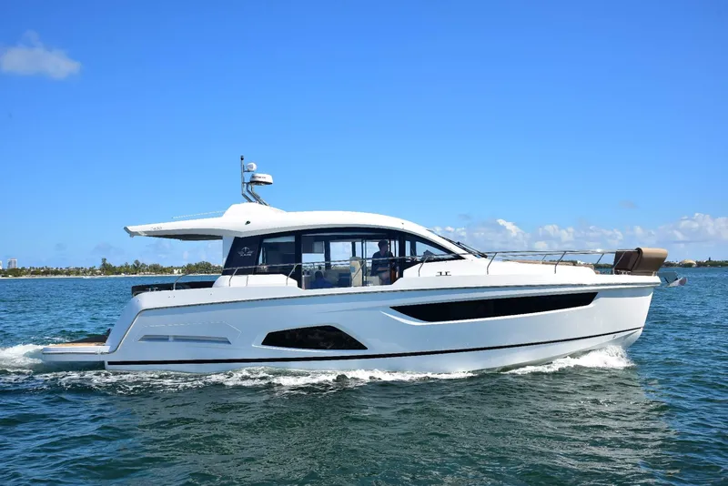Slide: The Image of 2022 Sealine C430 #42 yacht cruising on clear blue water under a sunny sky. - 12