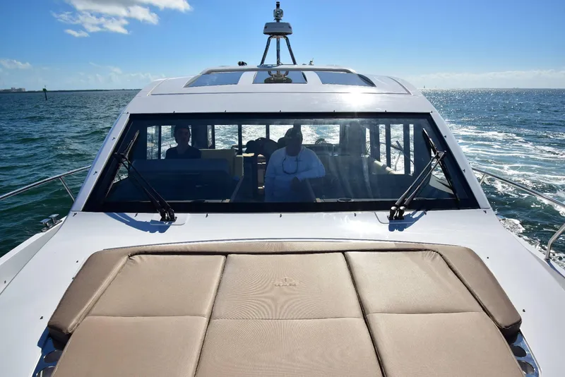 Slide: The Image of 2022 Sealine C430 #42 yacht cruising on open water under clear blue skies. - 14