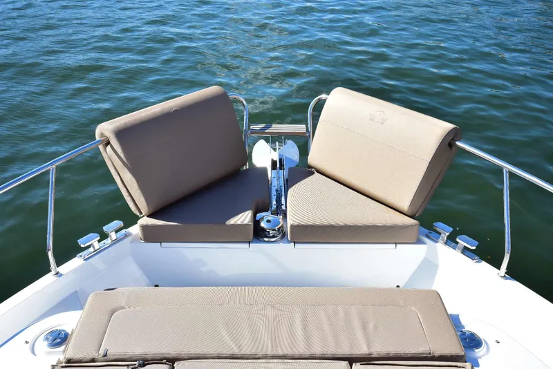 Slide: The Image of 2022 Sealine C430 yacht with beige seating on calm water. - 33