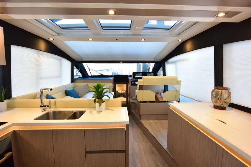 Slide: The Image of Luxurious interior of 2022 Sealine C430 yacht with modern kitchen and seating area. - 47