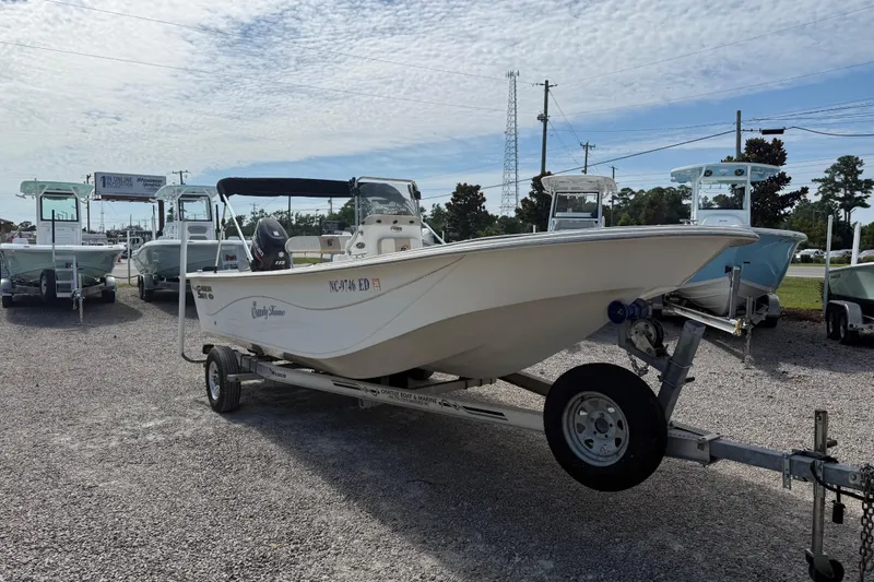 Slide: The Image of 2016 Carolina Skiff 218 DLV boat on trailer in outdoor lot. - 10