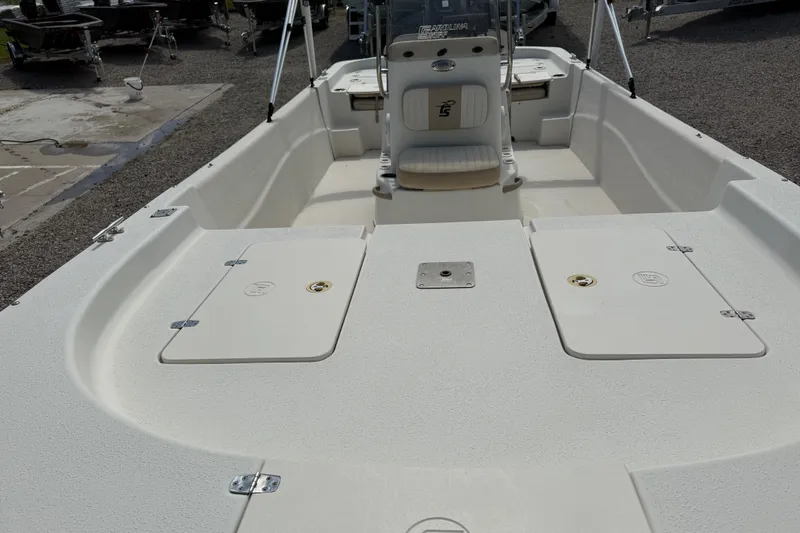 Slide: The Image of 2016 Carolina Skiff 218 DLV boat interior with storage compartments and seating. - 12