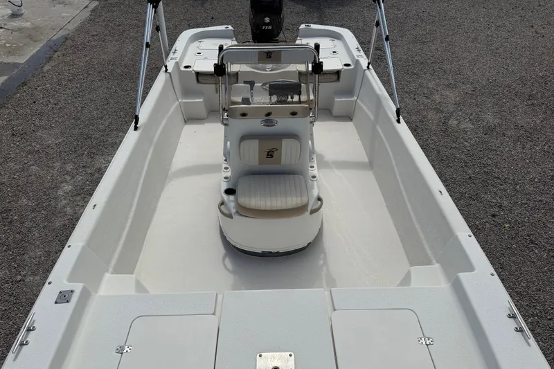 Slide: The Image of 2016 Carolina Skiff 218 DLV boat interior with center console and seating. - 13