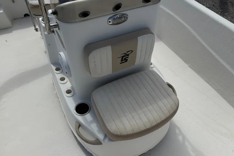 Slide: The Image of 2016 Carolina Skiff 218 DLV boat seat with cup holders and logo detail. - 15