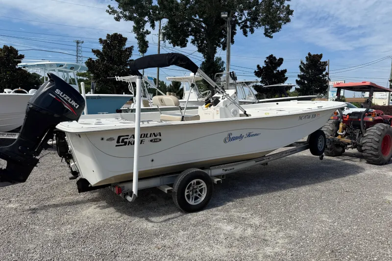 Slide: The Image of 2016 Carolina Skiff 218 DLV boat on trailer with Suzuki outboard motor. - 7