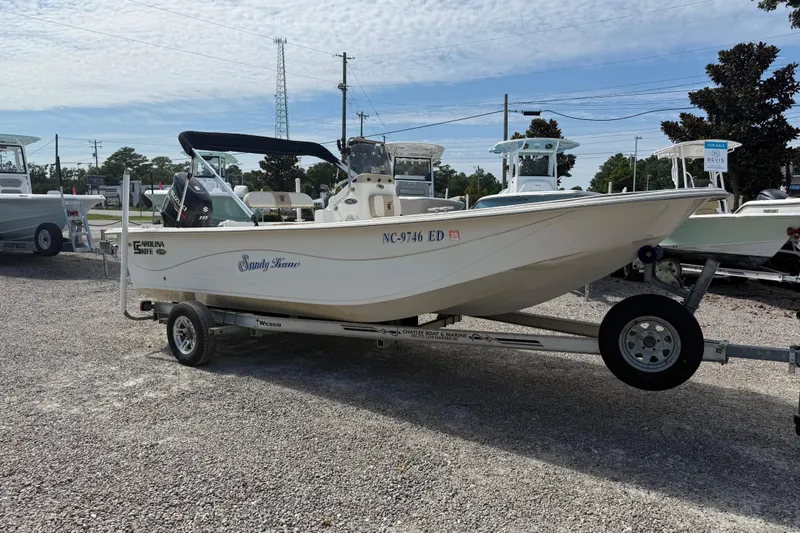 Slide: The Image of 2016 Carolina Skiff 218 DLV boat on trailer in outdoor lot. - 9