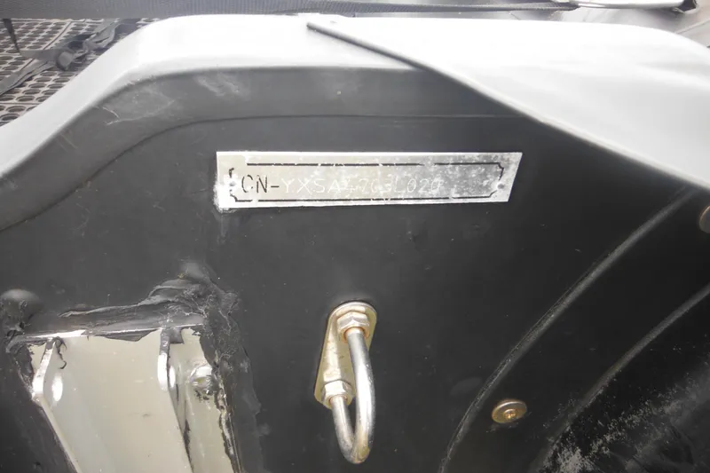 Slide: The Image of 2020 Bris BSA470 boat hull with identification plate and metal hook. - 6